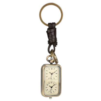 Chaveiro Relógio de Bolso Bronze sobre fundo branco, argola, tira de couro e relógio